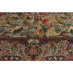 an antique persian rug with various designs and colors on the carpet is shown in full view