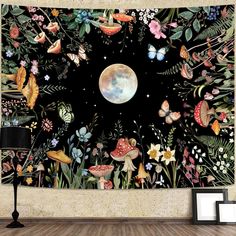 a wall hanging on the side of a wooden floor with flowers and butterflies around it