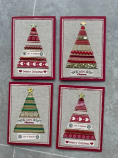 four christmas cards with different designs on them