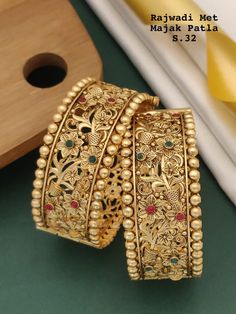 Description :- Indian bangle set/Metal bangles/Bridal Bangles/Designer bangle set for women/Wedding Jewelry/Festive Colorful Bangles/Bollywood jewelry set Gold Kada bangles /Indian bangles/Antique bangles/Temple Jewelry/Bridal Bangles/Indian Wedding/Pakistani Jewelry/South indian jewelry Gift yourself a royal look with this perfectly crafted necklace set from Manalisstudio. Crafted with high quality stones and pearls, it is impressive in design. The green enamel artwork adds perfect texture to t Bangles For Bride South Indian Weddings, Luxury Yellow Gold Temple Jewelry Bracelets, Luxury Gold Beads For Wedding, Gold Bangles Design Latest Indian, South Indian Bangles, Kada Bangles, Antique Gold Bracelet, Gold Kada