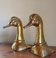 --> This mid-century pair of large partially hammered brass duck's head book supports was produced by Sarreid in the USA during the 1970s. Measures 10 1/2" in height and 5" width, weighing approximately 6 lbs each. They could even be used as doorstops! They're in fair vintage condition with pitting and wear, associated with age. Please review listing photos carefully.  We have added pictures of the birds in two settings to show variation of color with lighting  Seller Notes: --> Items will ship Call Bell, Hammered Brass, Door Stop, Decanters, The 1970s, The Birds, Making Mistakes, Ducks, Vintage Brass