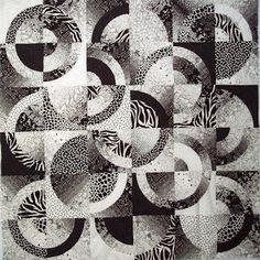 a black and white quilt with circles on it