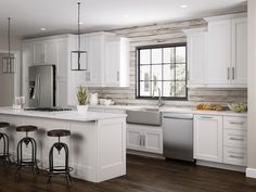 a kitchen with white cabinets and wood flooring is pictured in this image, there are three stools at the center of the island