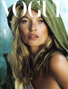 a woman with long hair wearing a green hoodie on the cover of a magazine