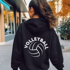 Volleyball Hoodie, Volleyball Sweatshirt, Volleyball Gift, Cute Volleyball Back and Front Hoodie, Volleyball Team Sweater ⭐️80% combed ring-spun cotton, 20% polyester (fiber content may vary for heather colors) ⭐️Medium-heavy fabric  ⭐️Regular fit ⭐️Runs slightly small. Consider sizing up. ⭐️Tear away label 👉SIZING👈 Our hoodies run a tad small. If you are wanting the shirt to be more fitted, you can order your regular size. If you are wanting a roomier shirt for comfort and oversize styling, then please reference our size chart and order up. Please refer to the size chart in the photos for measurements. 👉When Can I Expect My Order 👈 Processing Time: 2-5 days All items are sent to production as soon as the order is received. During holidays, please expect delays as the amount of orders Sporty Hoodie For Team Events And Sports Season, Sporty Hoodie Sweatshirt For Team Events, Volleyball Sweatshirts, Volleyball Hoodie, Volleyball Gifts, Volleyball Team, Gift Cute, Heavy Fabric, Volleyball