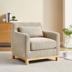 a chair sitting on top of a rug in a living room