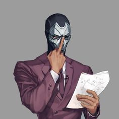 a man in a suit and mask holding a piece of paper with his hand to his face