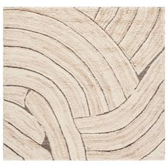 a beige rug with wavy lines on the bottom and sides, in an abstract manner