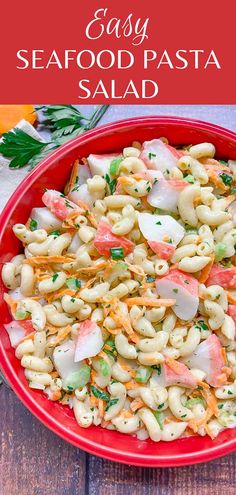 an easy seafood pasta salad in a red bowl on a wooden table with text overlay