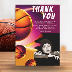 a thank you card with basketballs and a woman's hat on the table