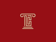 the letter t is inscribed in gold on a red background