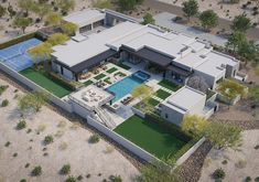 an aerial view of a house with a pool and tennis court