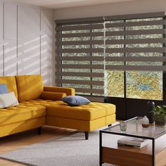 a living room with a yellow couch, coffee table and large window covered in blinds