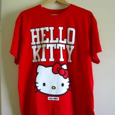 - Brand New, No Tags - Size: L - Sanrio License - 100% Cotton - Front And Back Fun Red Top With Screen Print, Fun Red Screen Print Top, Fun Red Letter Print T-shirt, Fun Red Tops With Letter Print, Cute Red Cotton T-shirt, Red Hello Kitty Cotton T-shirt, Red Cotton Hello Kitty T-shirt, Red Hello Kitty Print Crew Neck Top, Red Hello Kitty Short Sleeve Tops