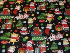 christmas cats and presents on black cotton fabric