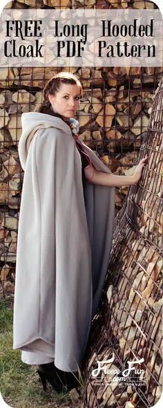 a woman wearing a cape standing next to a pile of logs with the text free long hooded cloak pattern