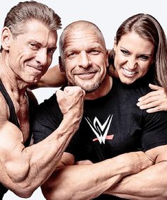 two men and a woman are posing for a photo with their arms around each other