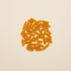 several pieces of pasta on a white surface