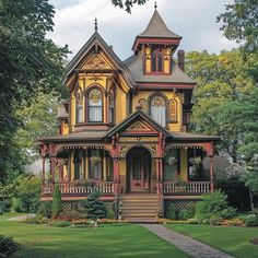 a large yellow and red victorian style house