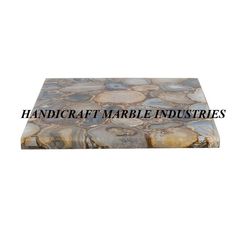 the words handcraft marble industriess are in black and white letters on a stone surface