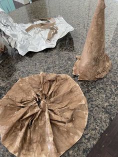 two pieces of brown paper sitting on top of a counter