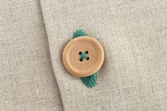 a wooden button on a suit jacket