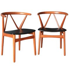 two wooden chairs sitting next to each other