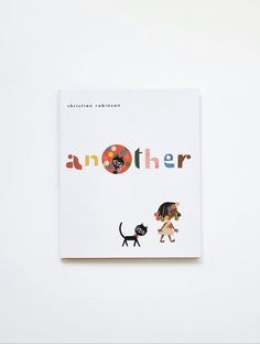 a book with an image of two dogs and a cat on it