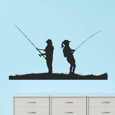 the silhouettes of two people fishing on a lake wall decal