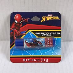 spiderman cherry flavored lip balm in the package on a white tablecloth