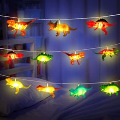 PRICES MAY VARY. Funny dinosaur string lights: 30 pieces of led dinosaur decorations light in 16.4 feet, including 8 different dinosaurs, such as stegosaurus, together creating a dinosaur world to your house, helping to release imagination out of children; Powered by 3 x AA batteries (not included), safe to touch Ideal gifts for kids: cute string lights to inspire interest of your kids, and if they are dinosaur fans, you will not miss out on this fantastic led string light; Decorate kid's bedroo Patio Christmas Tree, Room Decor For Boys, Tent Garden, Dinosaur Lamp, Dinosaur Decor Bedroom, Dinosaur Room Decor, Dinosaur Light, Dinosaur Bedroom, Dinosaur Room