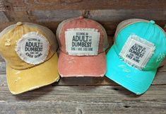 Most adults can say that Becoming an Adult is the Dumbest Thing I Have Ever Done. These funny hats are Distressed Criss Cross Ponytail Hats available in many colors with different shaped patches. Tattered Ponytail Hat 20% Cotton 80% Polyester Double Fabric Brim 7 Panel Hat Patches have frayed edges and are printed with permanent ink. They are adhered to the hat with an iron and strong double sided interfacing. While I do my very best to photograph items to see their true color, due to the nature Hat Sayings Ideas, Hat Sayings For Women, Funny Hats For Adults, Criss Cross Ponytail, Becoming An Adult, Ponytail Hats, Shirt Crafts, Cc Hats, Upcycle Clothing