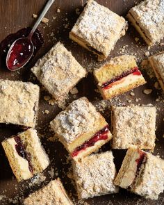 several pieces of cake sitting on top of a wooden table