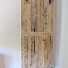 an old wooden door in the corner of a room