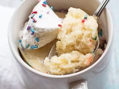 a cup filled with ice cream and sprinkles