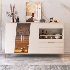 a white cabinet with glass doors in a room