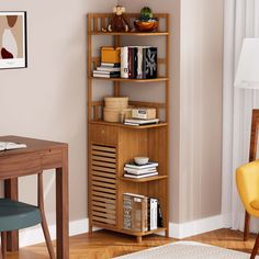 a room with a desk, chair and bookshelf