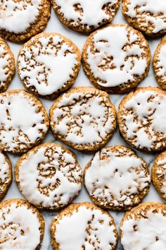 several cookies with white icing and sprinkles