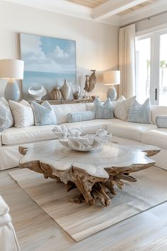 a living room filled with white furniture and pillows