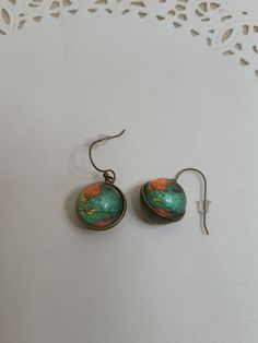 Globe Dangling Pierced Earrings with Nickel Free Wires No Return on This Item The earth globe is set in antique goldtone metal, both sides are the same picture - it does not show the entire earth 1 1/2in drop, 3/4in wide The components were purchased and assembled by me. J79 Multicolor Round Copper Jewelry, Artsy Round Green Jewelry, Same Picture, Earth Globe, Pierced Earrings, Earings Piercings, Jewelry Earrings Dangle, Dangle Drop Earrings, Globe