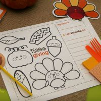 a table with thanksgiving themed items on it