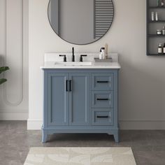 a bathroom vanity with a round mirror above it and a rug in front of it