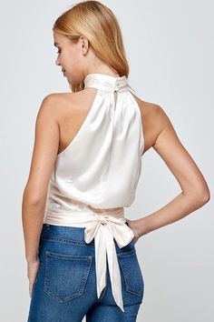 Our Viva Satin Top features a halter neckline, pleated mock neck with button closure at back, and tie sash at waist (could be tied to the front or back). Mock Neck Halter Top Satin Fabric 95% Polyester, 5% Spandex White Satin Top, Neck Halter Top, Stretch Satin Fabric, Top Satin, Love Jeans, Satin Top, Stretch Satin, Best Jeans, Halter Neckline