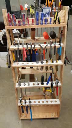 a wooden shelf filled with lots of tools