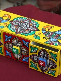 an elaborately painted box sitting on top of a table