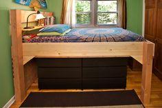 a bedroom with a bunk bed and drawers underneath the bed is made out of wood