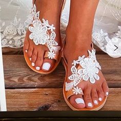 Gorgeous White Lace Flower Flip Flop Sandals White T-strap Sandals For Beach Season, White T-strap Sandals With Round Toe For Vacation, White Round Toe T-strap Sandals For Vacation, White Round-toe T-strap Sandals For Vacation, White Closed Toe T-strap Sandals For Spring, Elegant Flat Heel Sandals For Beach Season, Spring Beach T-strap Open Toe Sandals, White Flat Heel Sandals For Beach Season, Spring Beach Open Toe T-strap Sandals