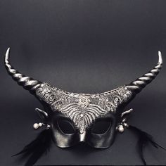 Our  mythical silver couple's masquerade mask set offers a bewitching fusion of power and enchantment that will captivate all who witness it. The silver wolf mask exudes strength and tenacity as a symbol of primal power. A testament to elegance and mystique, the women's long horns and intricate patterns convey a sense of enchantment.


Age Group/Gender - Adult/Unisex

Size/Type - One size fits all adults

Mask Color - Silver

Mask Material - Polyresin Horn Designs, Silver Masquerade Mask, Couples Masquerade Masks, Lace Masquerade Masks, Long Horns, Angry Wolf, Silver Mask, Wolf Mask, Masquerade Masks