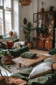 a living room filled with lots of green furniture