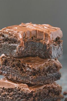 three chocolate brownies stacked on top of each other